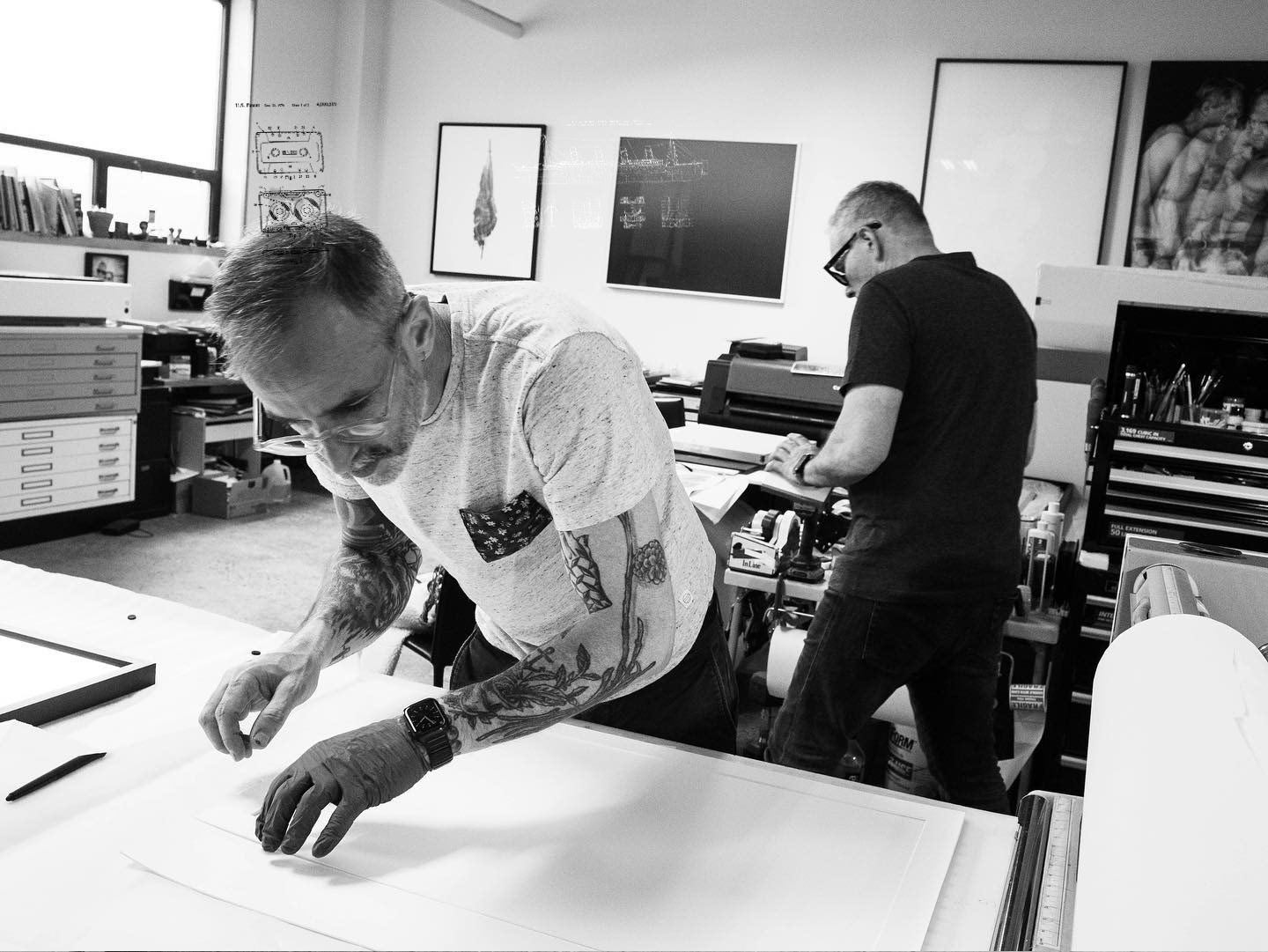 Black-and-white photograph of print studio preparation
